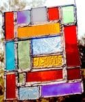 A colorful stained glass tile